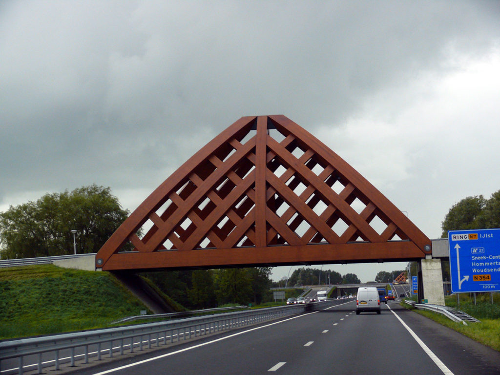 Architecturally designed bridge over highway. Photo.