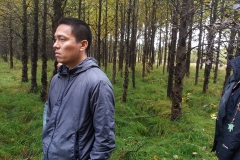 Man outside in forest. Photo.