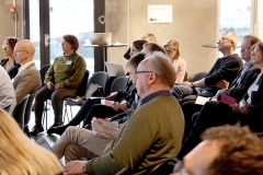 Small audience (seen from the side). Photo.
